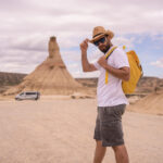 explorer in an arid national park looking at camer 2023 11 27 04 57 26 utc easy resize.com